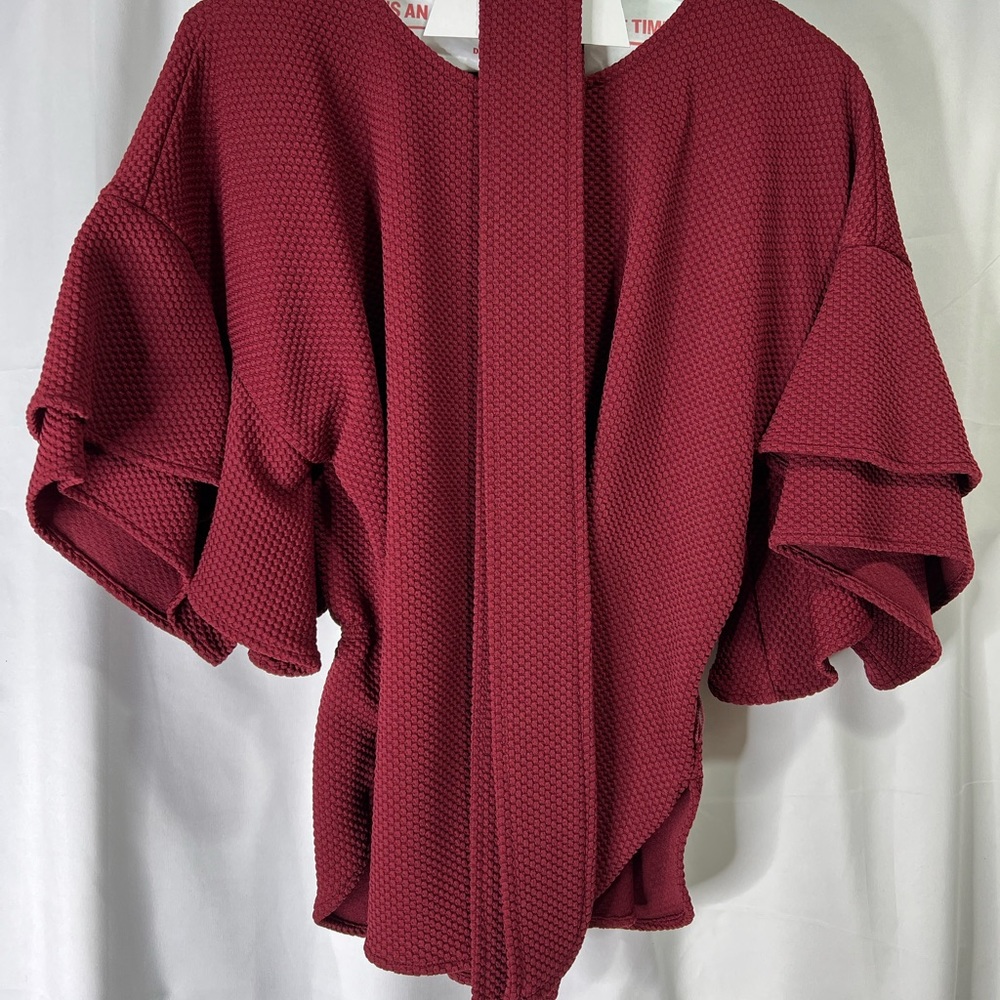 Belted flutter sleeve blouse. Never worn. Deep burgundy.